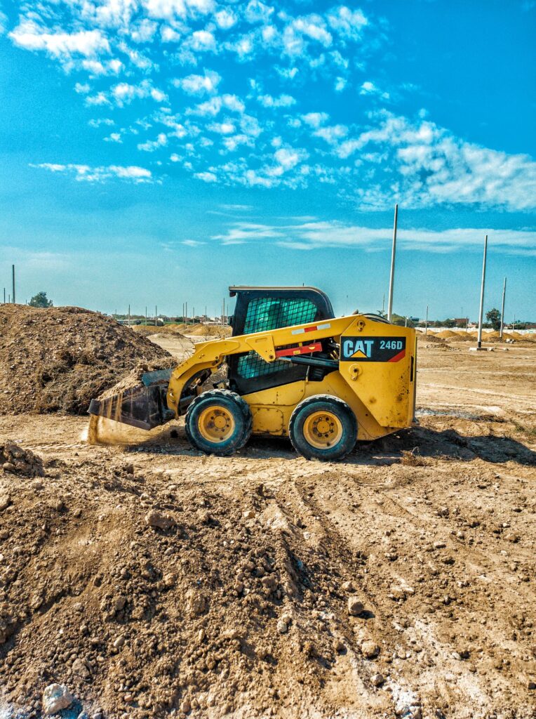 Skid steer loader working on a job site